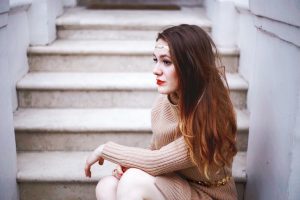 brunette sitting on doorstep in notting hill london